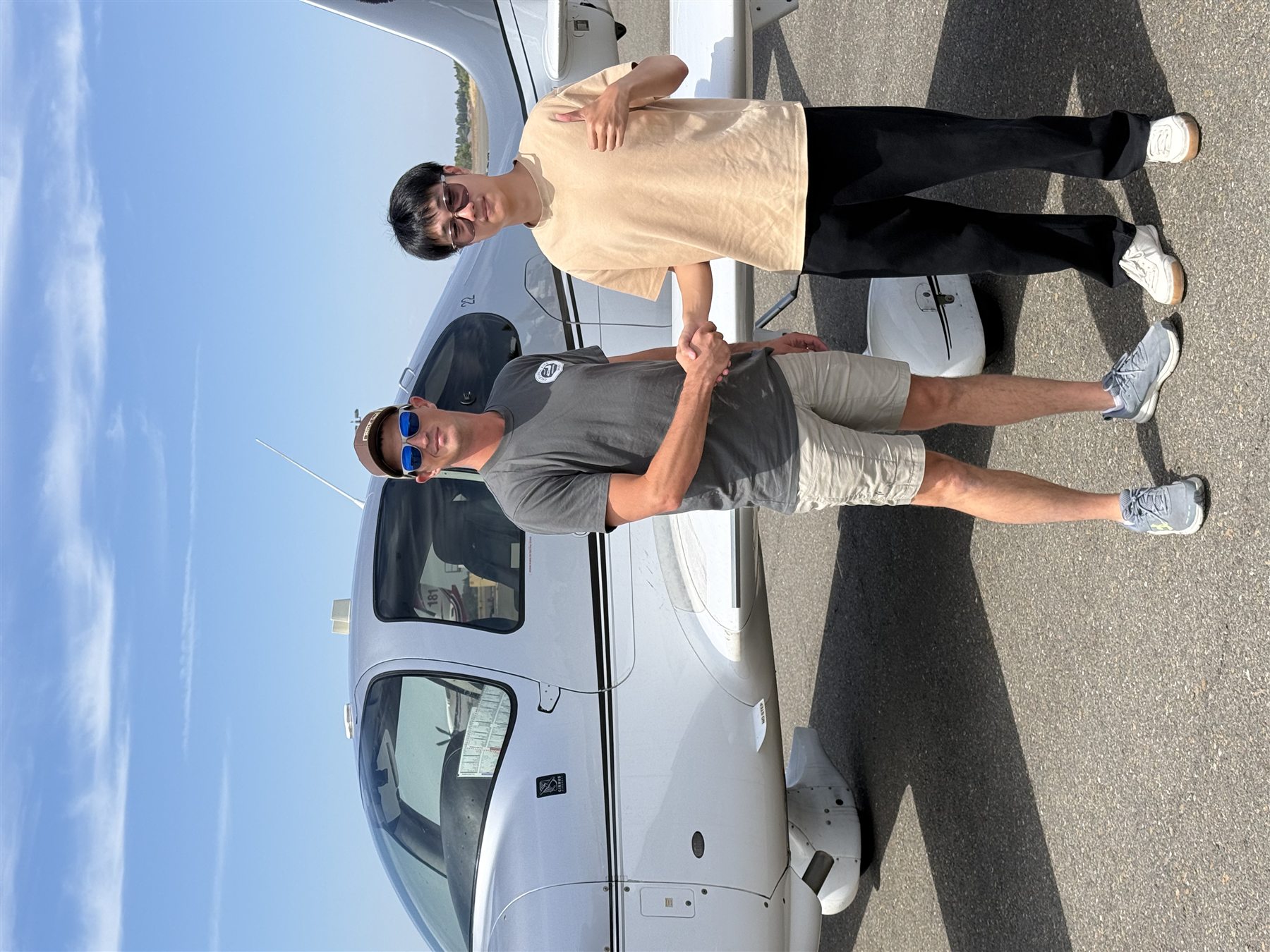 JJC Aviation instructor and student after flight training / 教员与学员